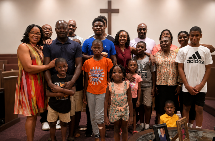 Church families and children gathered together in the sanctuary after a time of prayer